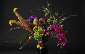 Pedestal display of orchids, eremurus, fruit and other novelty blooms